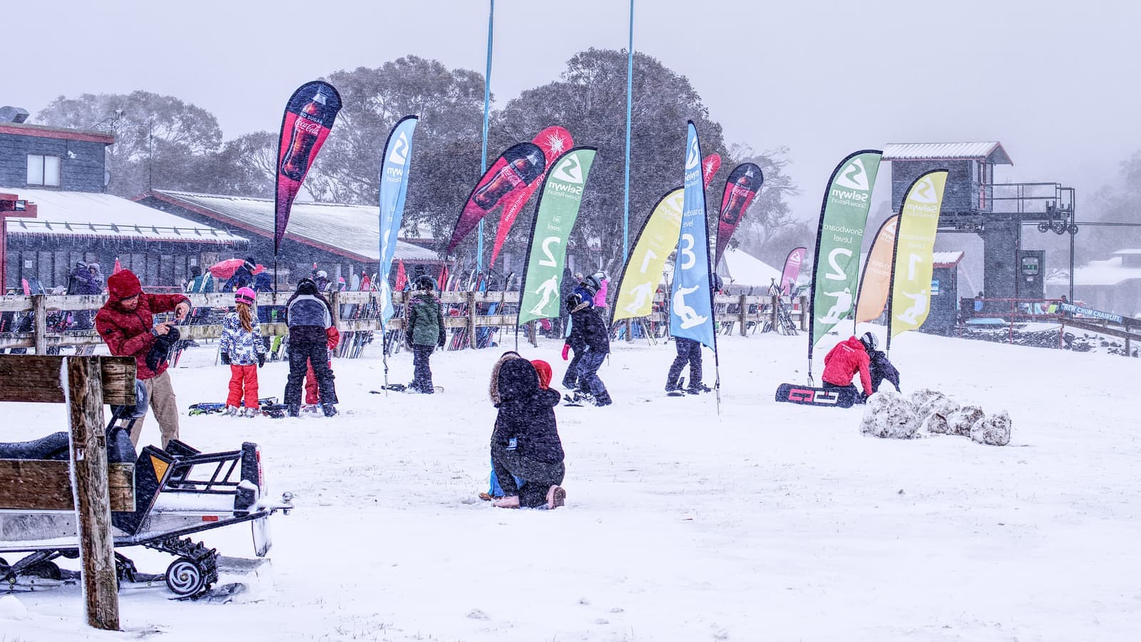 Families spending a snowy day together at a ski resort